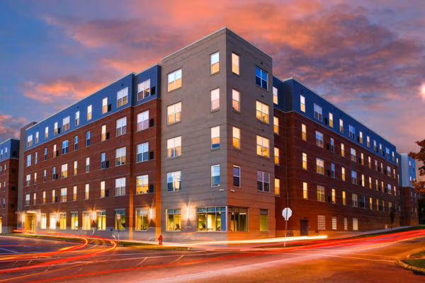 Five-story student housing at 345 Flats with brick exterior and street corner view